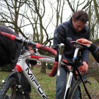 mw-gk-mario de clercq working on his sons bike in the pits-sm.jpg